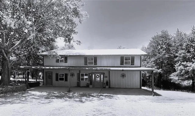 a view of a house with a stove and kitchen view