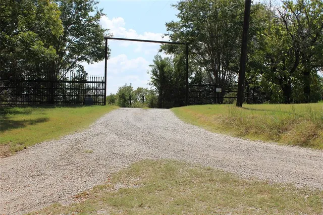 a view of balcony with chairs and wooden fence