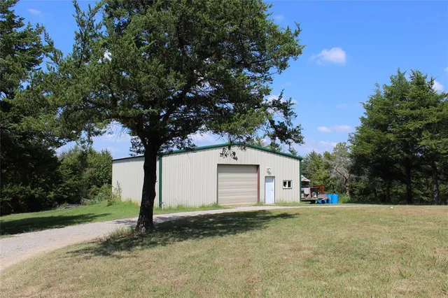 a view of a house with backyard space and porch