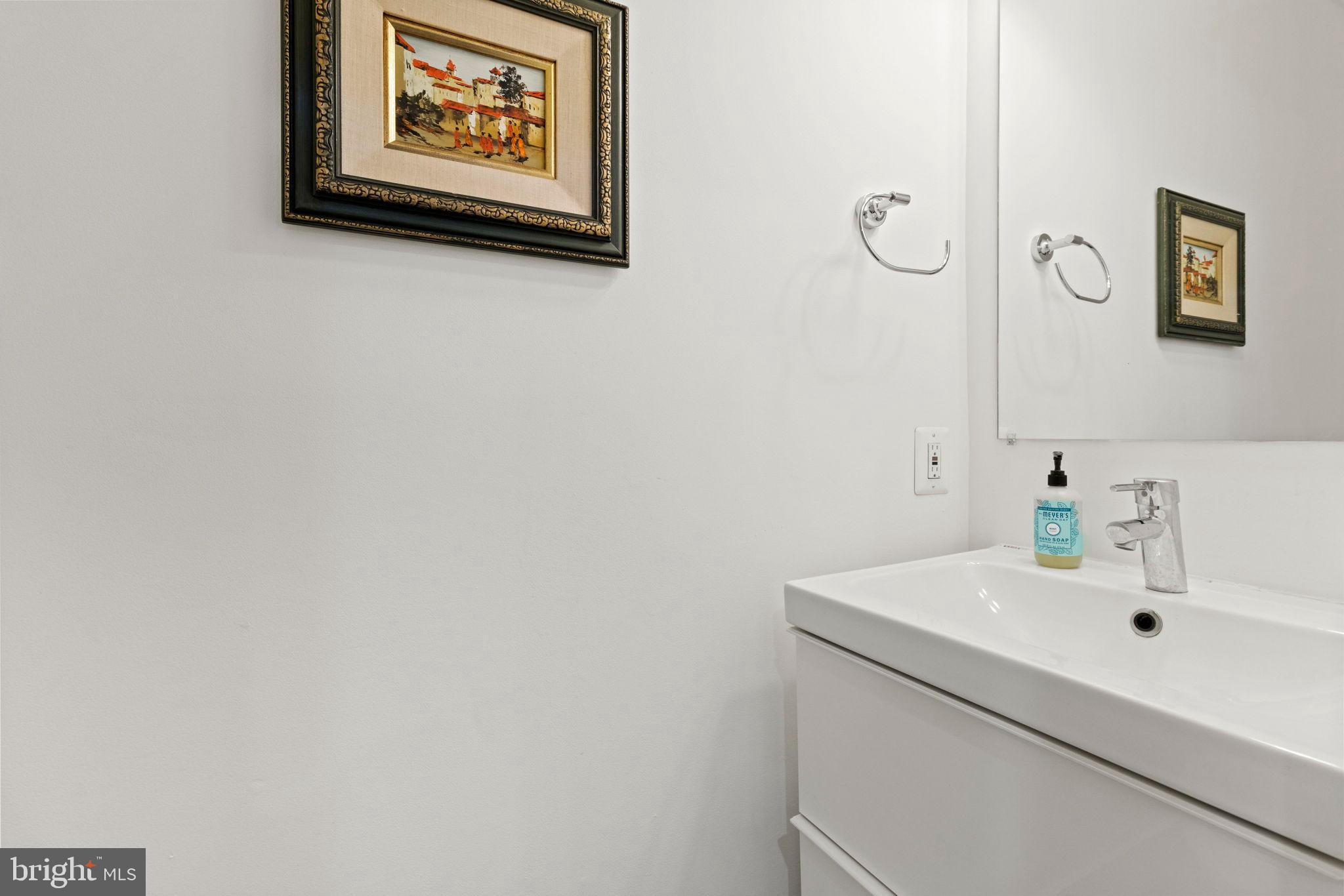 1928 First Street Northeast Washington, DC 20002 - Photo 12 of 26 a bathroom with a sink and a mirror