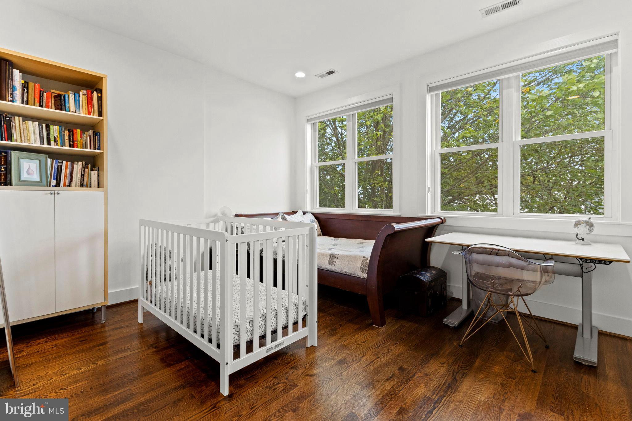 1928 First Street Northeast Washington, DC 20002 - Photo 13 of 26 a view of a bedroom with furniture and a window