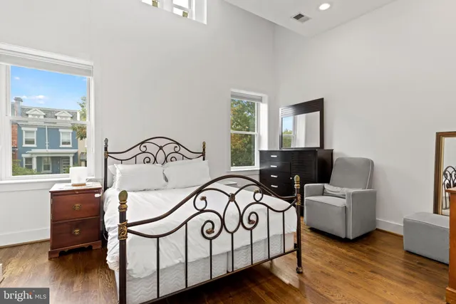 a bedroom with furniture and a window