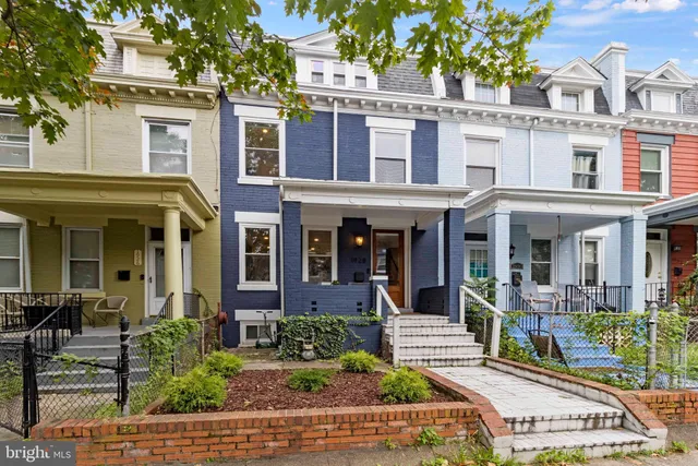 front view of a building with a yard