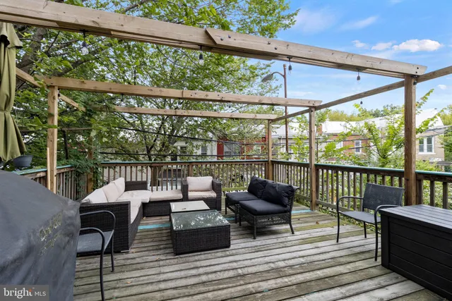 a view of balcony with couch and chairs