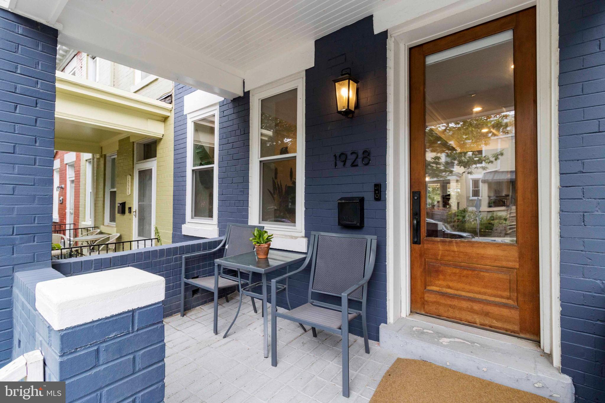 1928 First Street Northeast Washington, DC 20002 - Photo 3 of 26 a view of a room that has a bed and a table in it