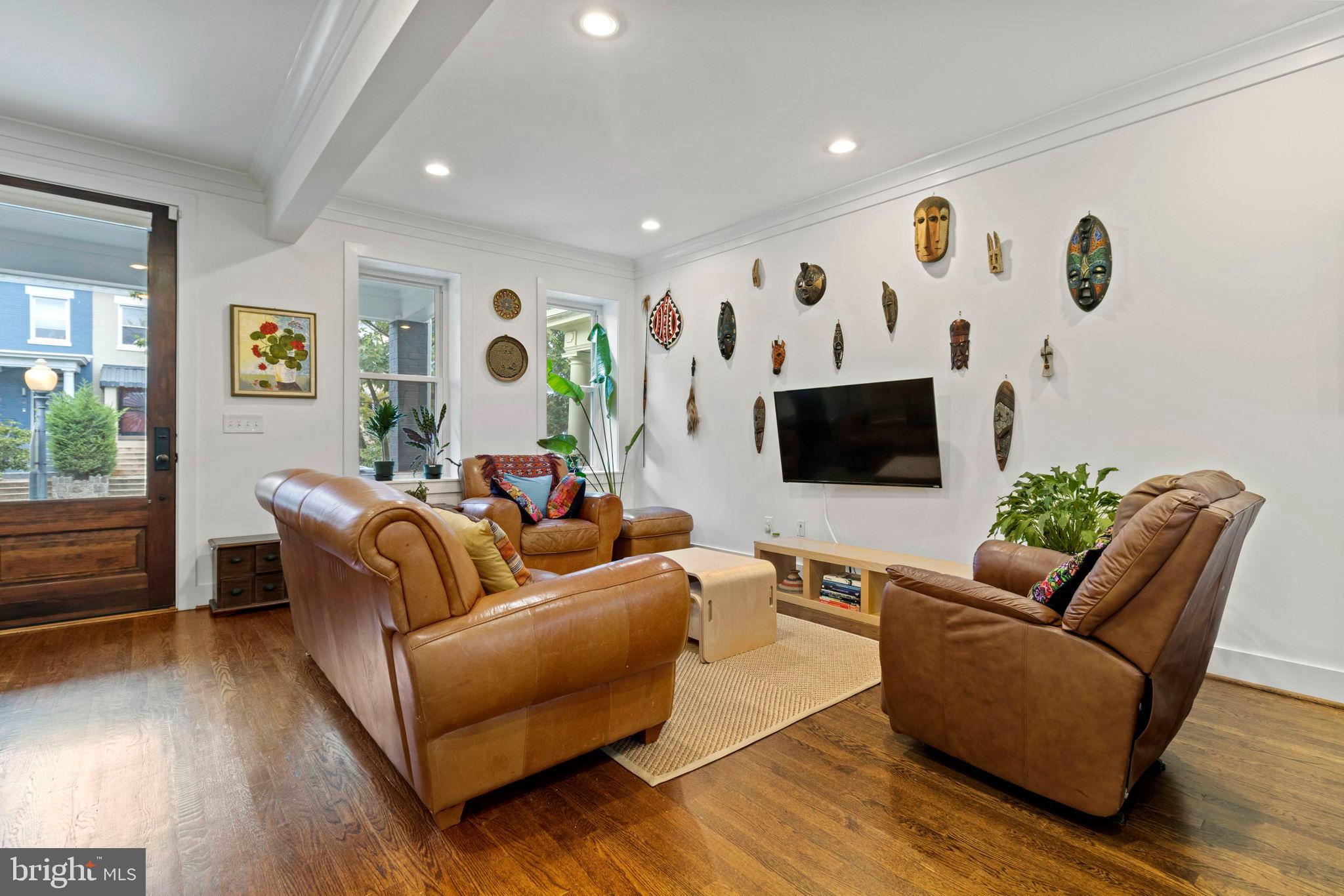 1928 First Street Northeast Washington, DC 20002 - Photo 6 of 26 a living room with furniture and a flat screen tv