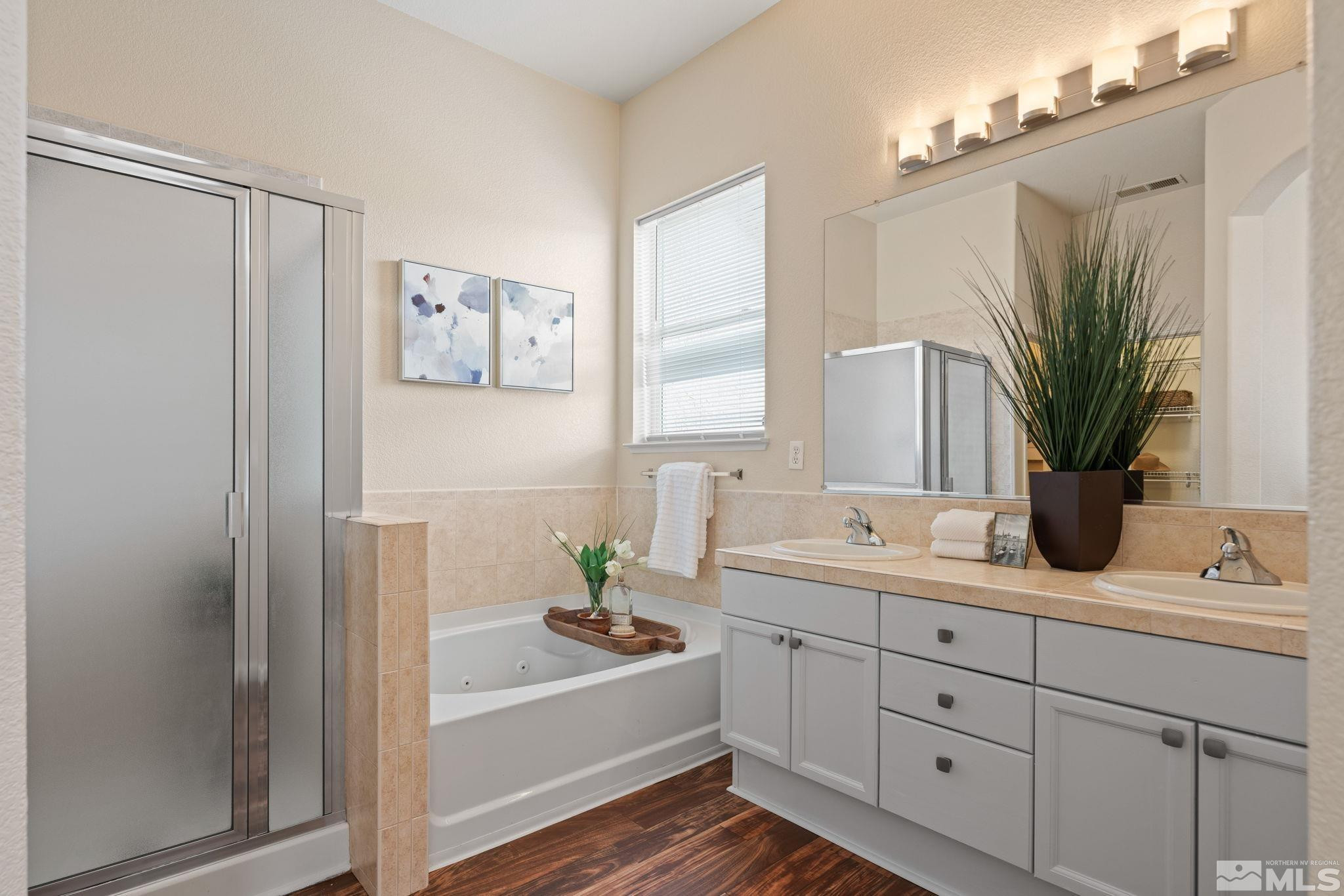 9516 Rockcrawler Road Reno, NV 89521 - Photo 23 of 39 a bathroom with a tub sink and mirror