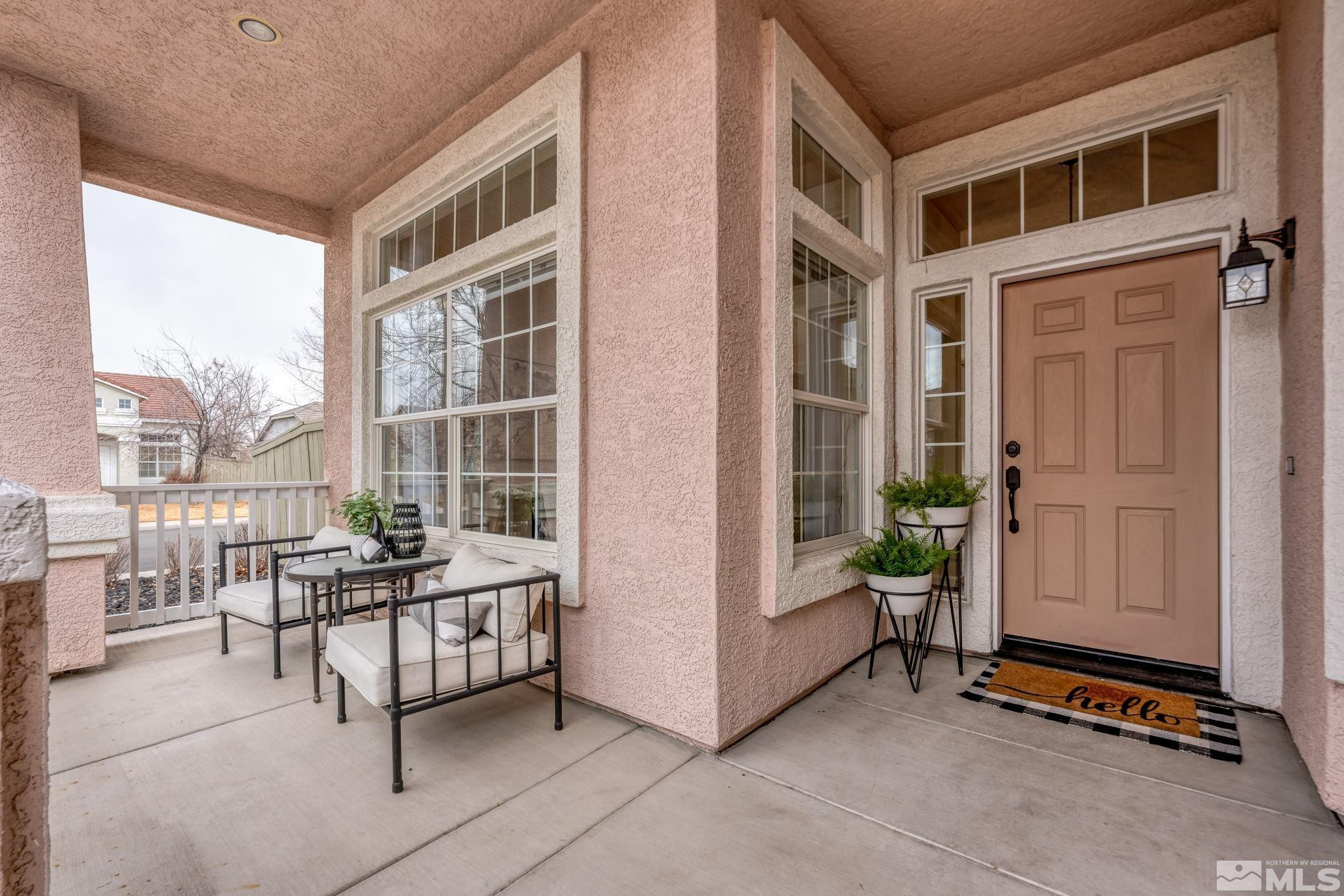 9516 Rockcrawler Road Reno, NV 89521 - Photo 3 of 39 a balcony with furniture and front door