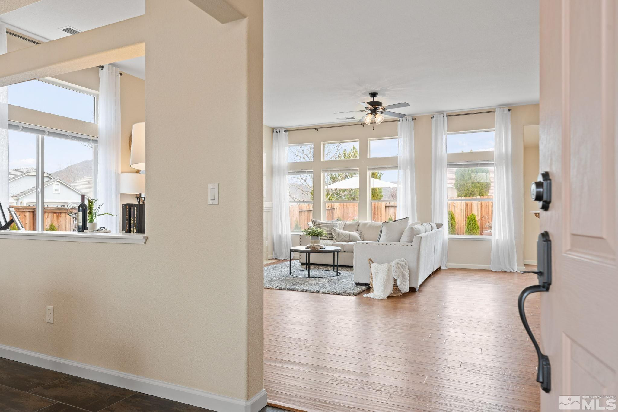 9516 Rockcrawler Road Reno, NV 89521 - Photo 4 of 39 a view of living room with furniture and floor to ceiling windows