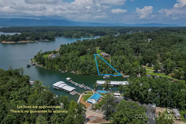 an aerial view of house with yard swimming pool and outdoor seating
