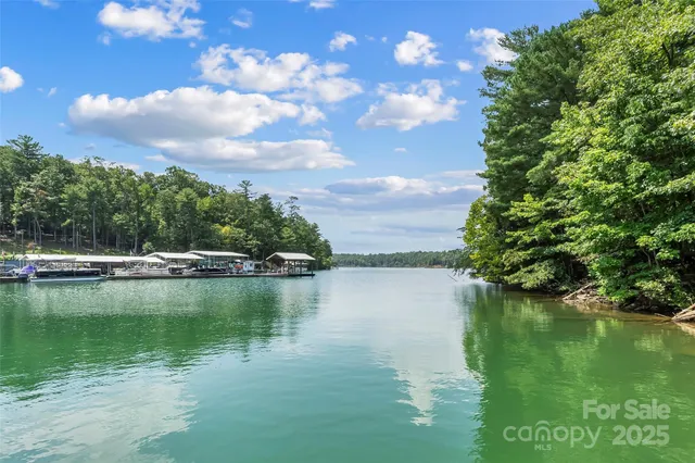 a view of a wooden deck and lake view