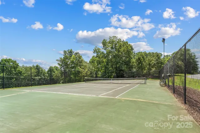 a front view of a house with a yard and a garage