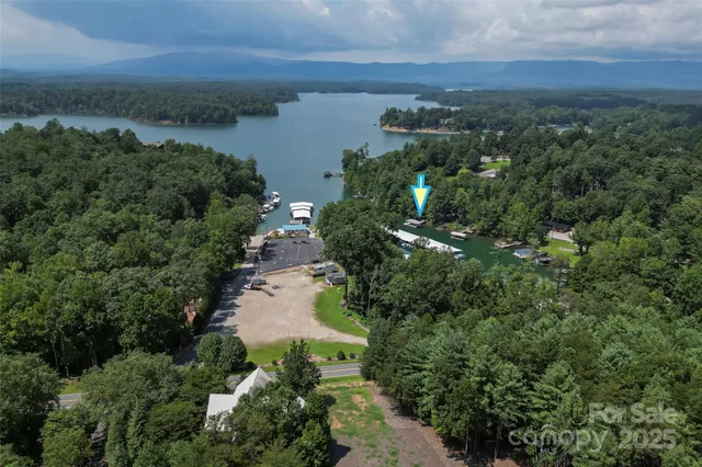 an aerial view of residential house with outdoor space and lake view