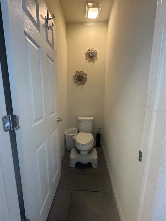 11626 Dublin Grafton Riverview, FL 33579 - Photo 16 of 32 a bathroom with a toilet