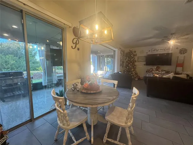 a dining room with furniture and window