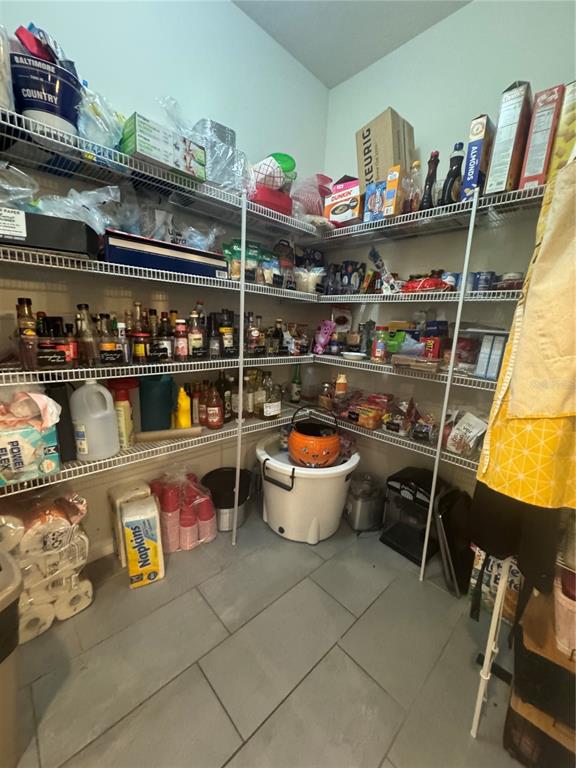 11626 Dublin Grafton Riverview, FL 33579 - Photo 25 of 32 a room with lots of different colored cloths