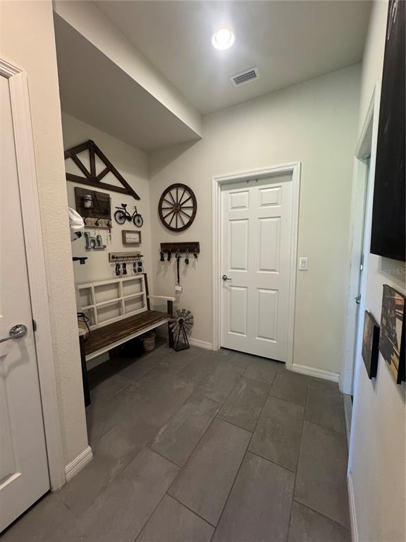 11626 Dublin Grafton Riverview, FL 33579 - Photo 27 of 32 a view of a storage & utility room with a fridge