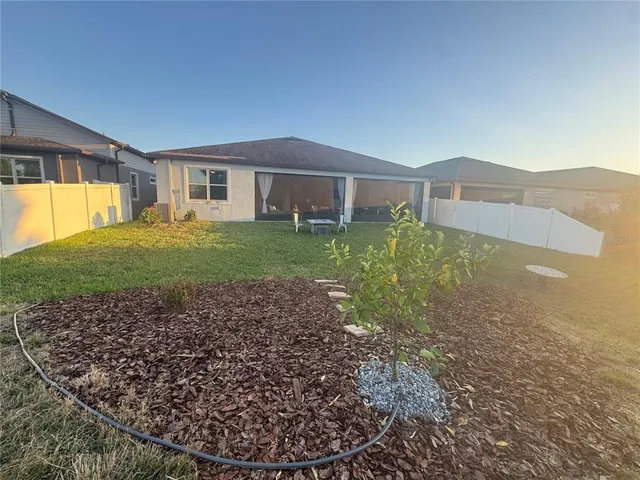 a house view with a backyard space