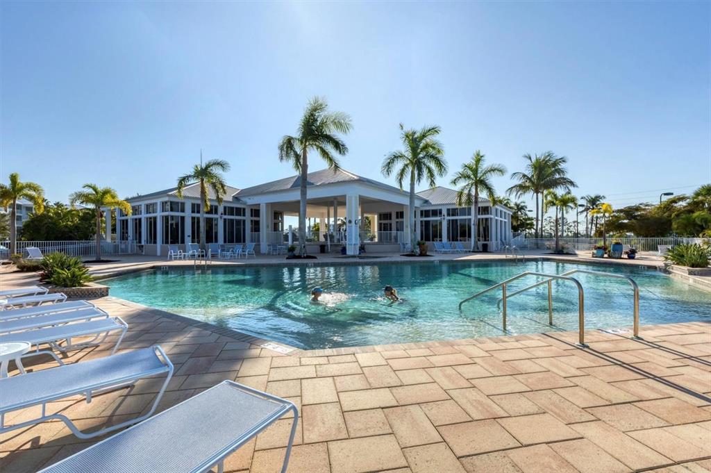 8413 Placida Road, Unit 407 Placida, FL 33946 - Photo 36 of 57 a view of house with outdoor space and swimming pool