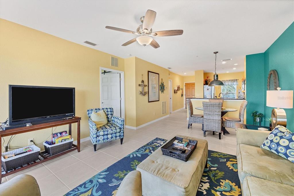 8413 Placida Road, Unit 407 Placida, FL 33946 - Photo 5 of 57 a living room with furniture and a flat screen tv