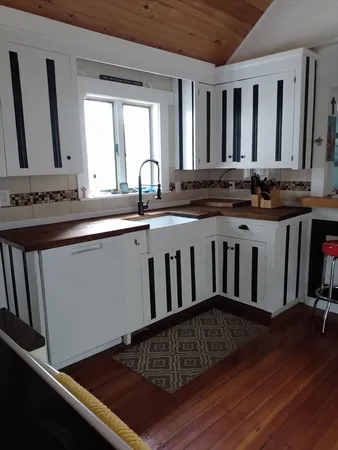 a kitchen with a stove and a sink