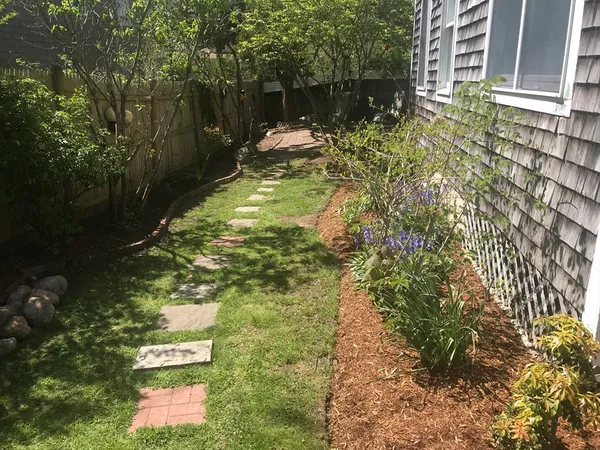 a backyard of a house with lots of green space