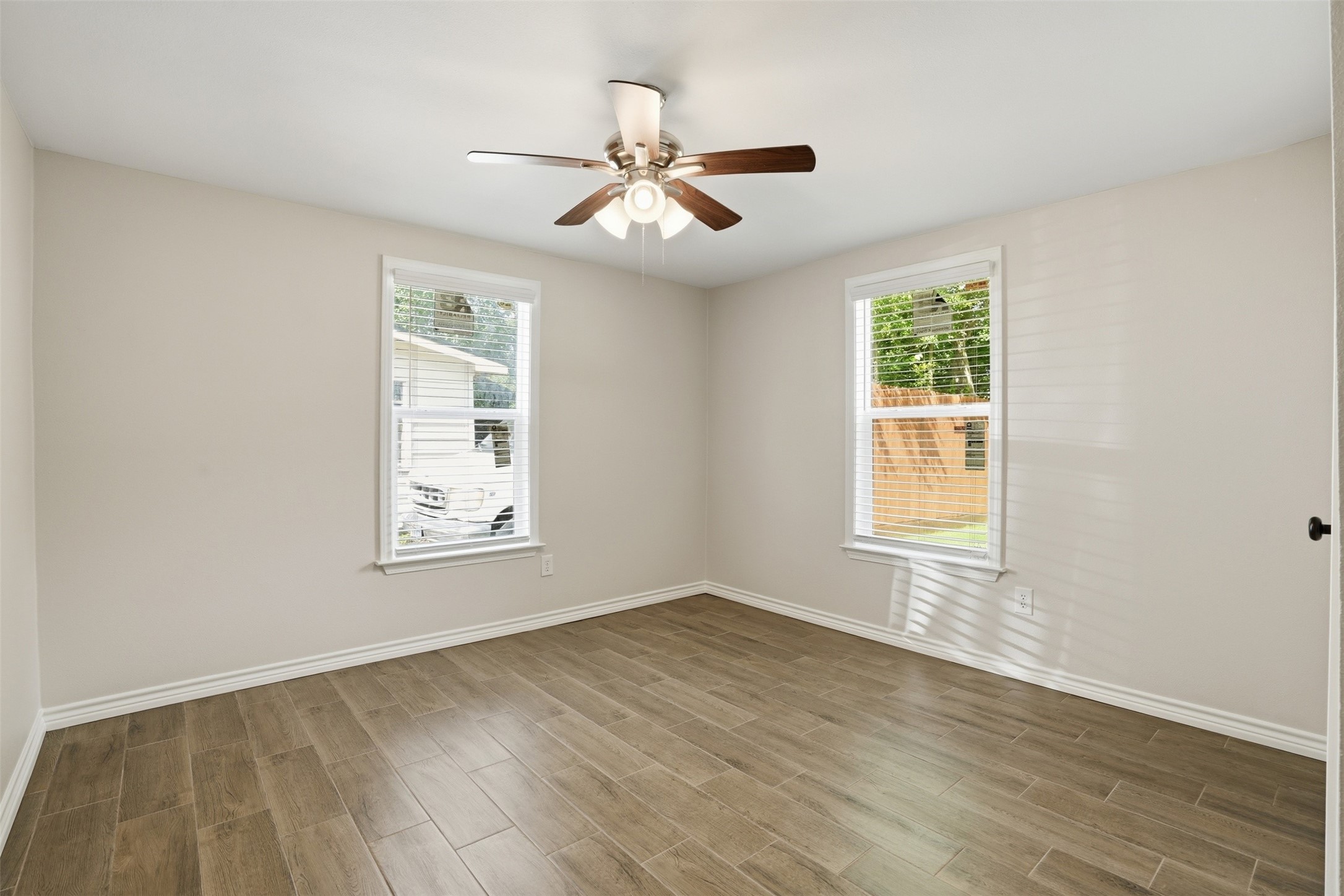 6518 Paris Street Houston, TX 77021 - Photo 20 of 23 a view of an empty room with wooden floor and a window