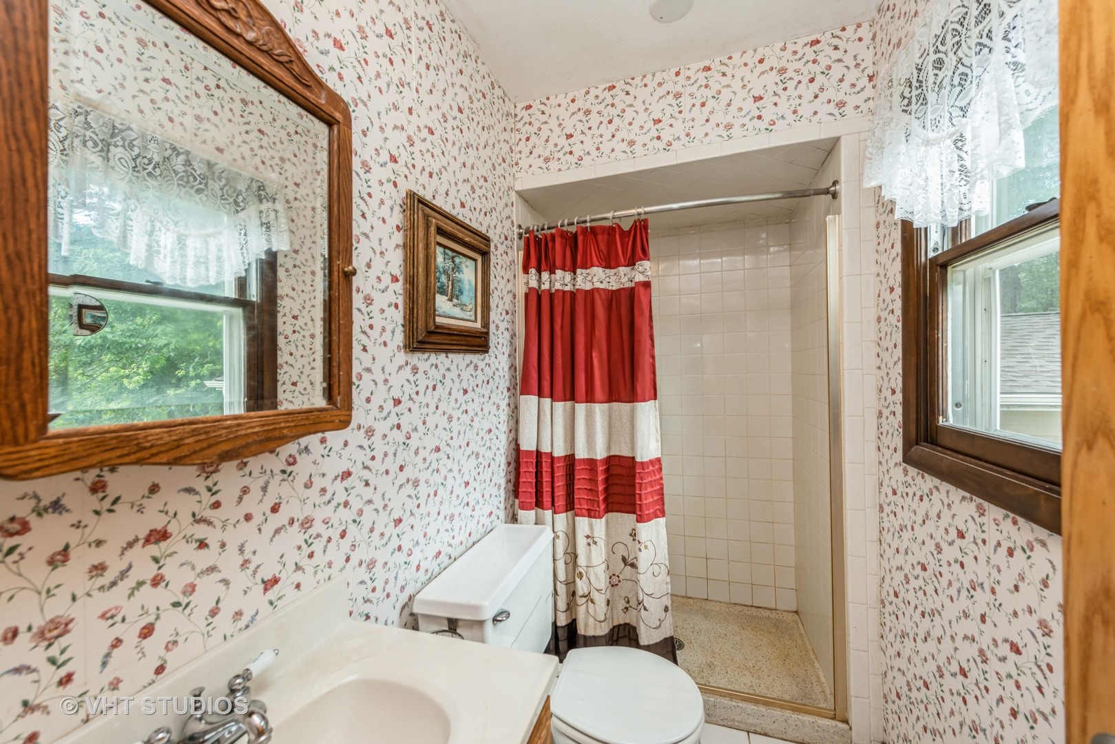 8308 Schmidt Street Spring Grove, IL 60081 - Photo 11 of 33 a bathroom with a sink toilet and shower