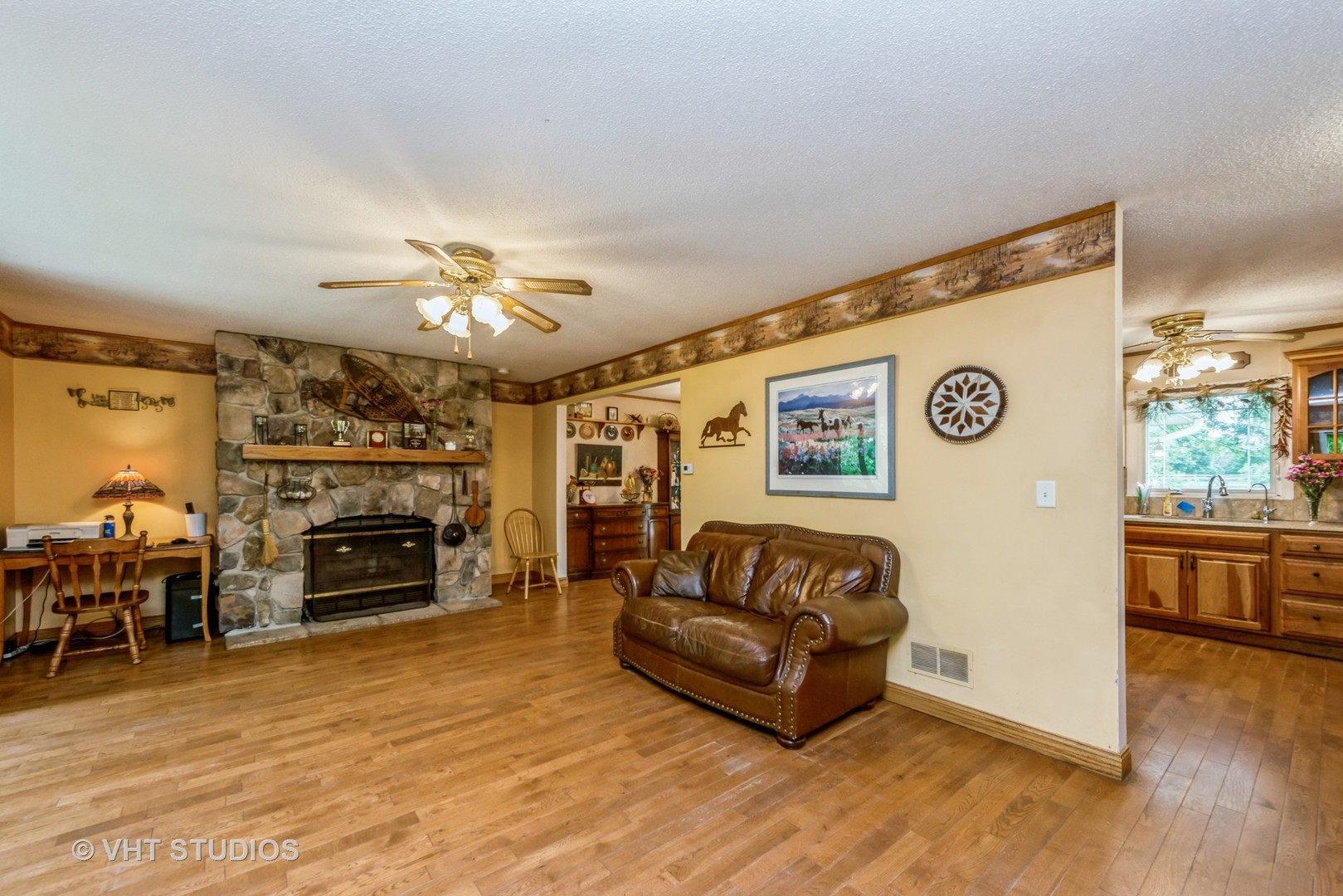 8308 Schmidt Street Spring Grove, IL 60081 - Photo 3 of 33 a living room with furniture and a fireplace