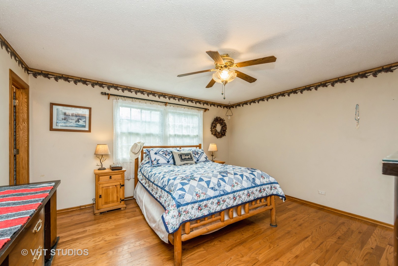 8308 Schmidt Street Spring Grove, IL 60081 - Photo 10 of 33 a bedroom with a bed and a chandelier