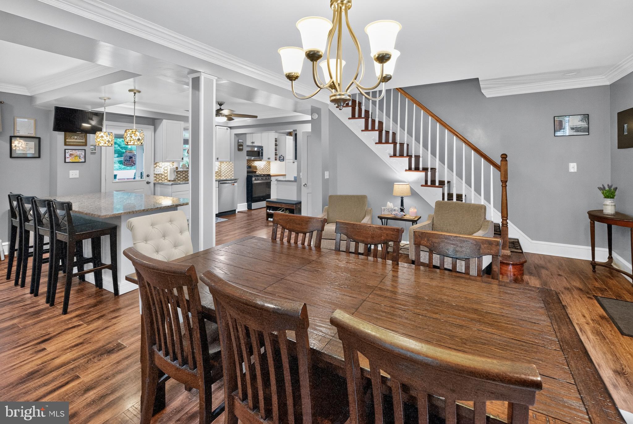68 New Road Southampton, PA 18966 - Photo 9 of 27 a dining room with wooden floor furniture and a chandelier
