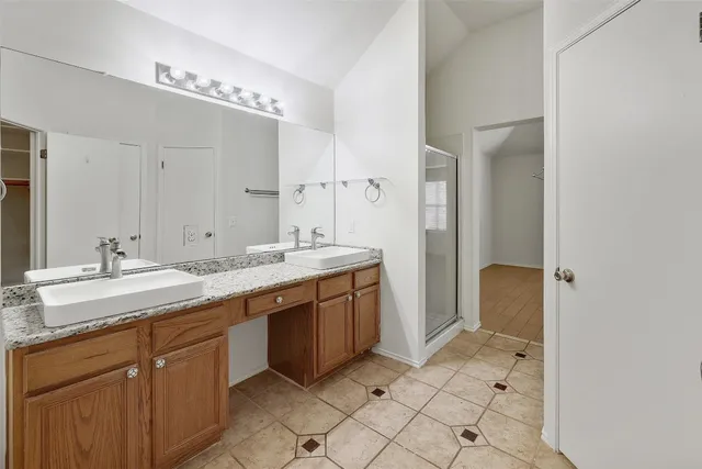 a bathroom with a granite countertop sink mirror and a