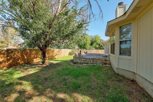 a view of yard with trees
