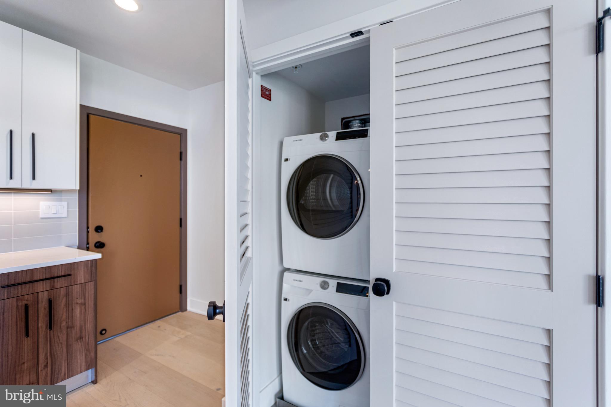 845 19th Street Northeast, Unit PH12 Washington, DC 20002 - Photo 19 of 23 a view of a hallway with washer and dryer