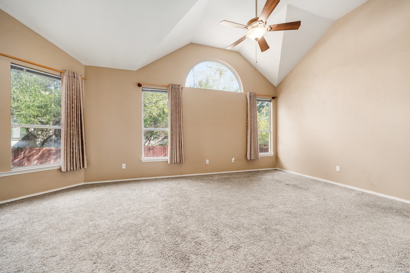 1108 Antelope Ridge Cedar Park, TX 78613 - Photo 7 of 39 An arched transom window accents high vaulted ceilings over soft carpeting.