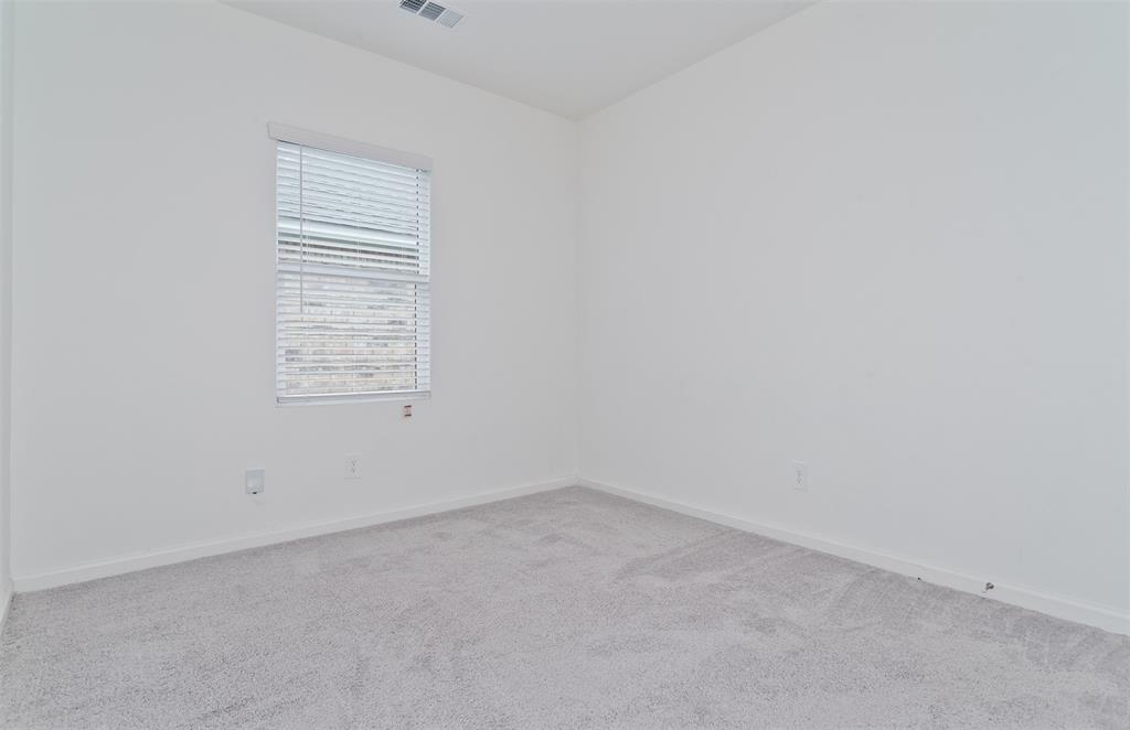 1637 Shadow Hawk Drive Fort Worth, TX 76052 - Photo 17 of 20 an empty room with windows