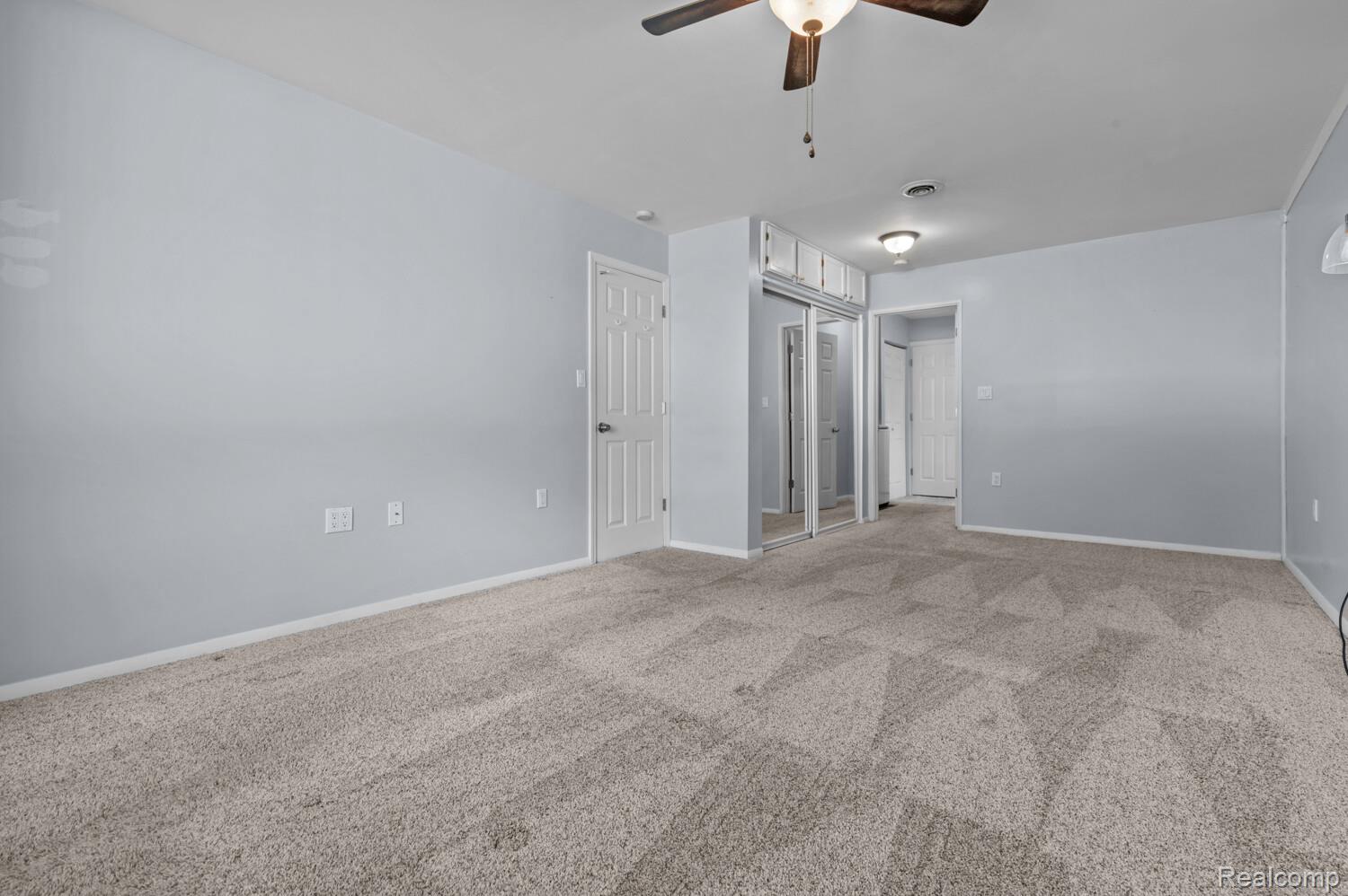 11026 Colony Pinckney, MI 48169 - Photo 20 of 40 Empty room featuring carpet and a ceiling fan