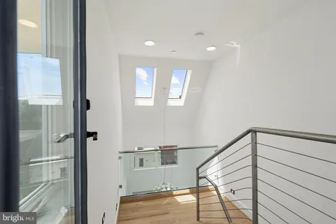 a view of a balcony with chairs and a table
