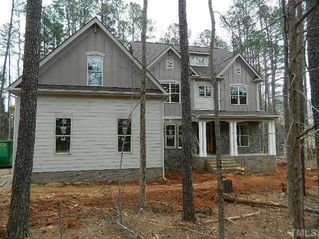 9404 Carlswood Court Raleigh, NC 27613 - Photo 1 of 20 a front view of a house with garden
