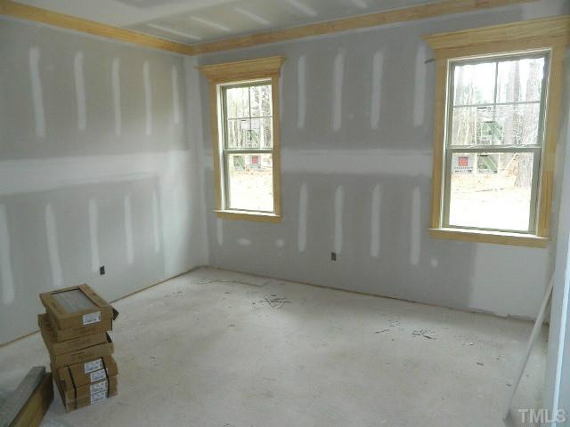9404 Carlswood Court Raleigh, NC 27613 - Photo 8 of 20 an empty room with windows