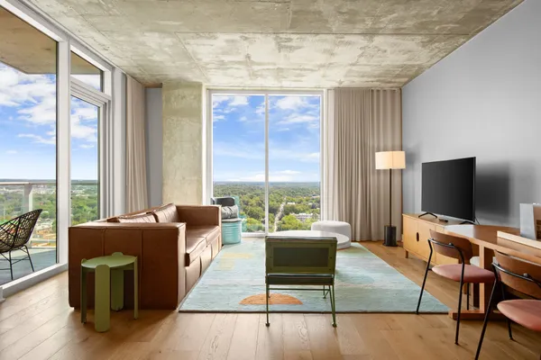a living room with furniture and a flat screen tv