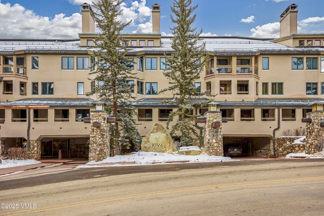 a front view of a building with parking