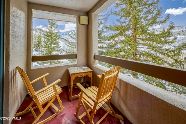 a view of a city from a dining room with large windows