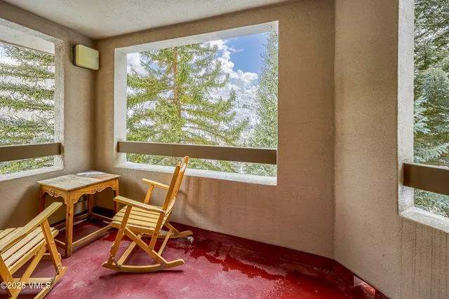 a work room with furniture and windows