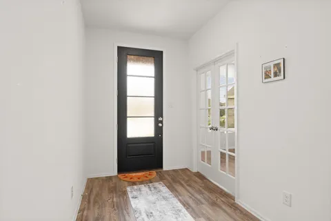 a view of entryway with wooden floor