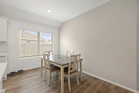 a workspace with furniture and wooden floor