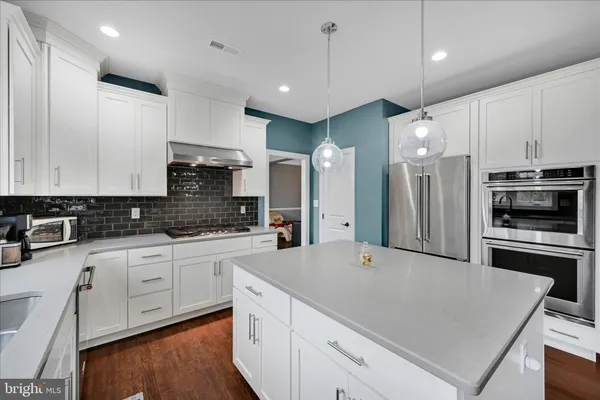 a large kitchen with cabinets