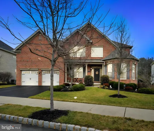 a view of a big house with a yard
