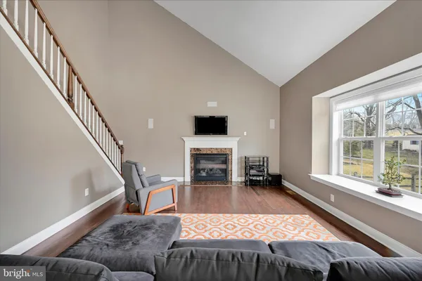 a view of a livingroom with furniture and a fireplace
