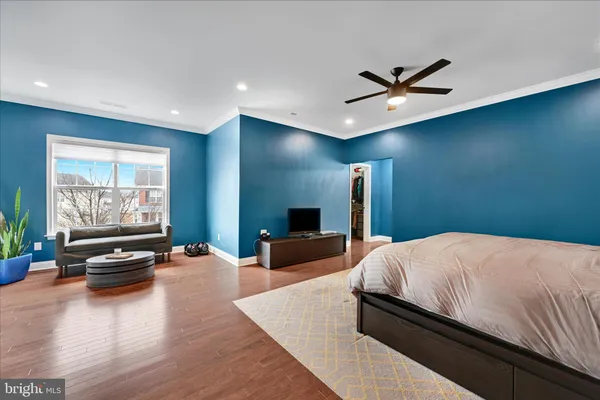 a bedroom with a bed and couch